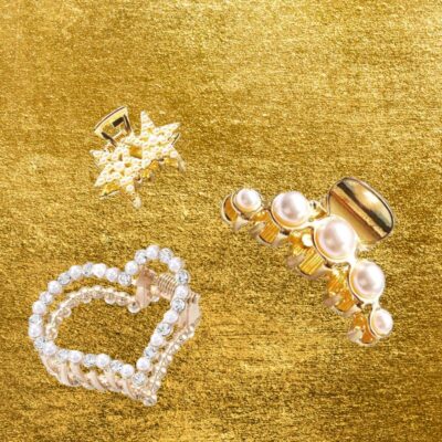 Haarklammern gold auf goldenem Hintergrund