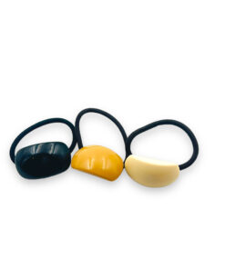 Schwartze Zopfgummis mit schwatz, orange, weißen Halbkreis